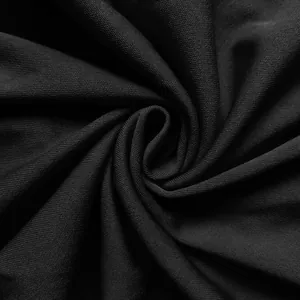 Macro view showing the fine texture and elegant drape of black dress textile material