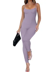 Full body detail of a purple ribbed spaghetti strap jumpsuit shown on a fit model