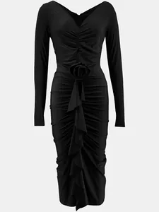Detail of elegant black V-neck dress featuring central rose and ruffled textures