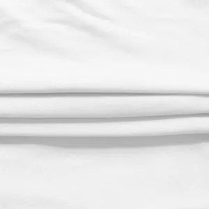 Close-up of white fabric texture showing fine weave and soft folds for office dress