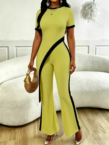 Modern lime green two-piece set with asymmetrical top and black contrast details