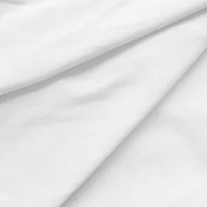 Close-up macro view of the high-quality white fabric texture of women's office dress.