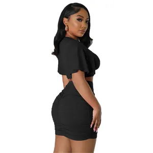 Elegant women's two-piece fashion set with black crop top and ruched bodycon mini skirt