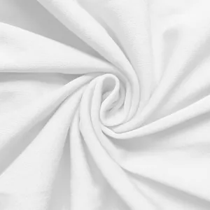 Close-up detail of white knitted fabric texture showing fine weave and soft drape.