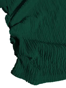 Close-up detail showing the rich pleated texture of a dark green vacation style set