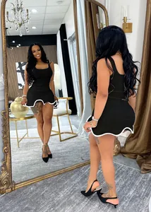 Detailed back view of a sleeveless black bodycon mini dress with white wavy hem design