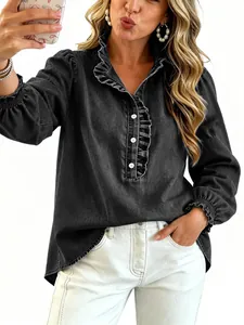 Close-up detail of black denim shirt with stylish ruffled collar and puff sleeves