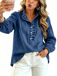 Detailed view of a stylish blue denim shirt featuring elegant ruffles and casual cuffs.