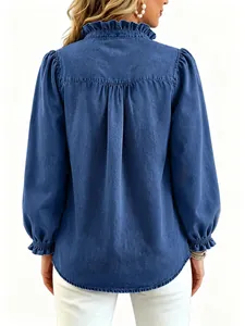 Back view of a blue denim shirt with princess sleeves and ruffled collar details