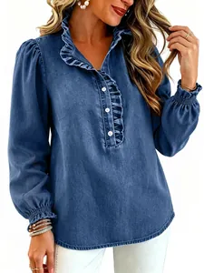 Close-up detail of blue denim shirt featuring elegant ruffle collar and princess puff sleeves