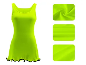 Close-up detail of the ribbed knit fabric and ruffled hem of this neon green tank dress.