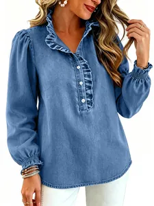 Detail view of fashionable blue denim blouse featuring ruffled collar and princess sleeves