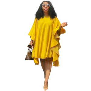 Vue détaillée d'une robe jaune grande taille avec des manches chauve-souris à volants