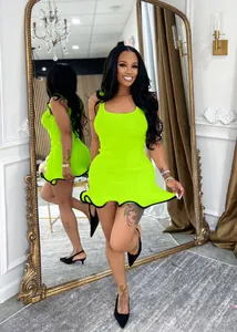 Vibrant lime green sleeveless bodycon mini dress with wavy ruffled hem and black trim.