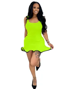 Vibrant neon green sleeveless ribbed knit mini dress with ruffle hem on model
