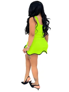 Side view of vibrant neon green sleeveless mini dress with wavy black trim hem.