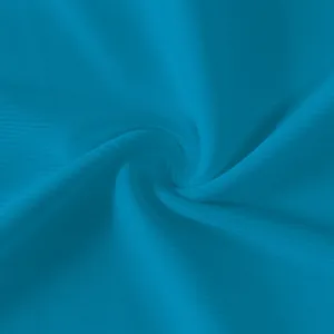 Detailed macro view showing the high-quality turquoise ribbed knit fabric texture