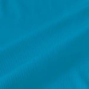 Macro shot showing detailed texture of vibrant blue ribbed knit fabric for summer tank dress