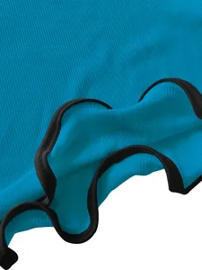 Detailed macro view of high-quality blue ribbed fabric with black lettuce hem