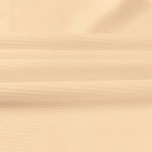 Detailed macro shot of beige ribbed fabric texture for sleeveless slim fit tank dress.