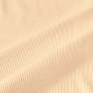 Detailed macro view of high-quality beige ribbed fabric texture for summer bodycon dress