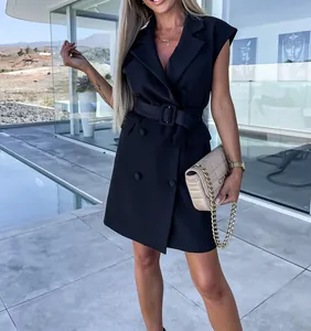 Detail of black sleeveless blazer dress with double-breasted buttons and belt