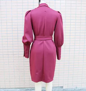 Back view of a maroon shawl collar dress featuring puff sleeves and a waist tie belt