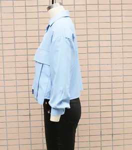Side view detail of light blue loose batwing sleeve shirt for stylish office wear