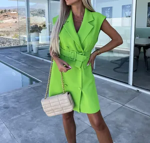 Lime green sleeveless blazer dress with double-breasted buttons and a belt detail