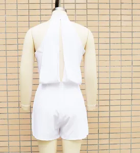 Back view of a white halter neck sleeveless romper with cutout detail