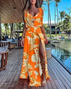 Detailed view of vibrant orange floral two-piece set with high slit skirt at a resort