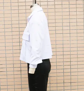 Side profile detail of a white loose-fit batwing sleeve office shirt on mannequin