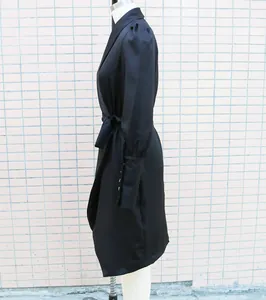 Detailed side view of elegant black shawl collar long-sleeved wrap dress for women