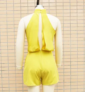 Back view of a vibrant yellow halter neck sleeveless romper with a high-waisted design.