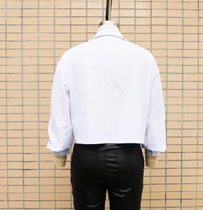 Back view of a white loose-fit women shirt with batwing sleeves and collar detail.