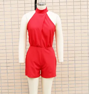 Front view detail of a vibrant red sleeveless high neck romper on a mannequin
