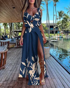 Detailed view of navy tropical print two-piece set with wrap maxi skirt and bra top.