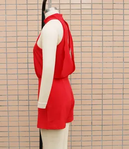Side view detail of a vibrant red high-neck sleeveless romper on mannequin.