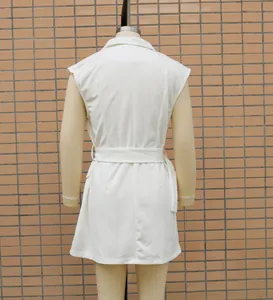 Back view of a minimalist white sleeveless blazer dress with a matching belt for women