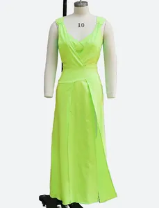 Close-up detail of a vibrant neon green two-piece sleeveless maxi dress set on mannequin