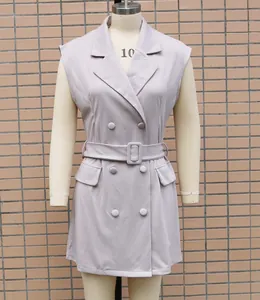 Close-up of lavender sleeveless blazer dress featuring double-breasted buttons and belt