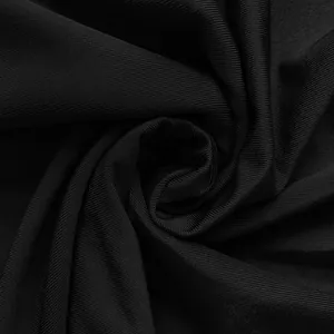 High-quality detailed close-up view of black ribbed fabric texture for long sleeve dress