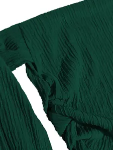Macro view of dark green crinkled fabric texture on stylish summer vacation set