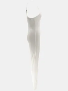Side profile detail of a white ribbed backless bodysuit jumpsuit with spaghetti straps.