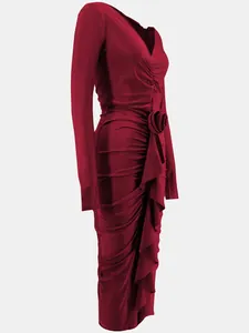 Side detail view of an elegant red long-sleeve V-neck ruched dress with rose decoration