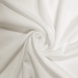 Close-up macro view of premium soft white ribbed fabric texture for a tight jumpsuit