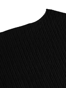 Detailed view of the black crinkled fabric texture for the elegant one-shoulder outfit set
