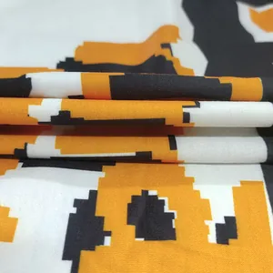 Detailed macro view showing the soft texture of pixelated color block fabric on a hoodie