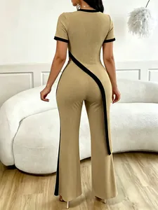 Detailed back view of khaki two-piece set with black contrast slash top and flared pants