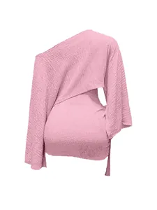 Detail of elegant pink one-shoulder knit top and matching bodycon mini skirt set